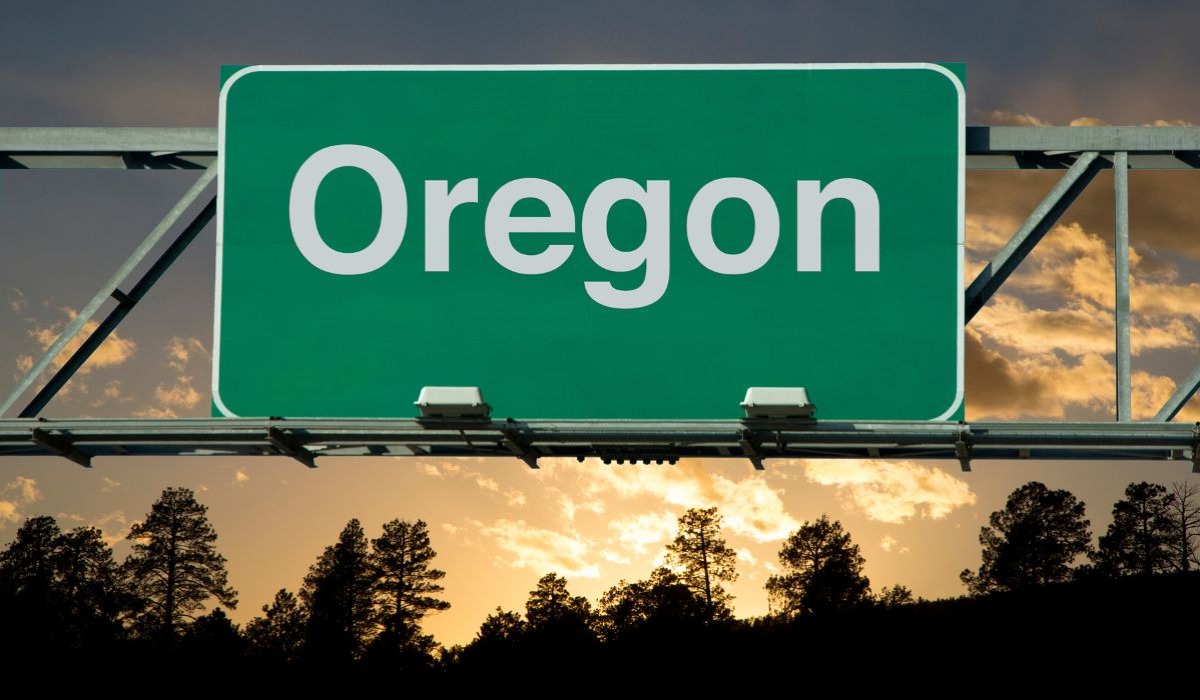 Oregon road sign at sunset