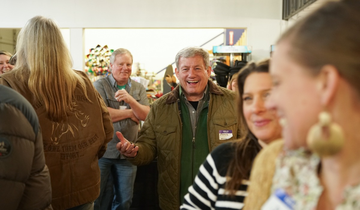 People smiling and talking at April 2025 tourism networking event