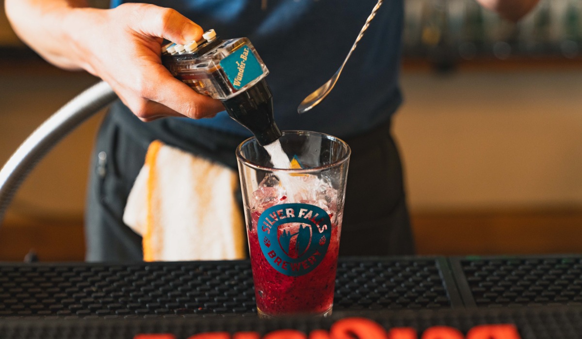 mixing a drink at Silver Falls Brewery